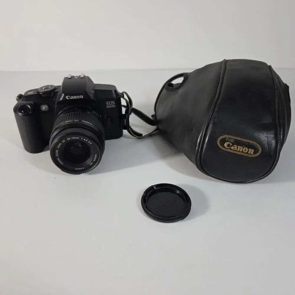 Canon EOS 5000 with 38-76mm EF zoom, UV filter, strap